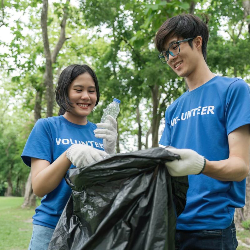 volunteering-charity-cleaning-young-and-ecology-concept-group-of-happy-volunteers-with-garbage.jpg